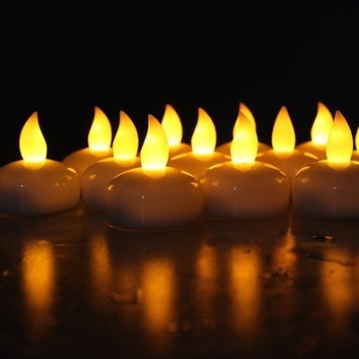 Velas conduzidas Flameless amarelas de Tealight, luzes conduzidas a pilhas do chá