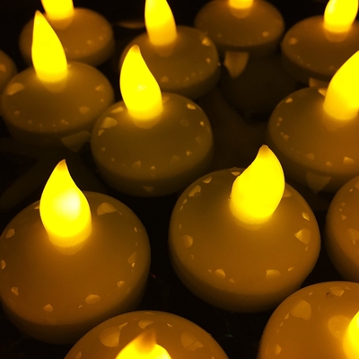 Grupo da luz conduzida de cintilação da vela 12 - Tealight amarelo com substituição da bateria
